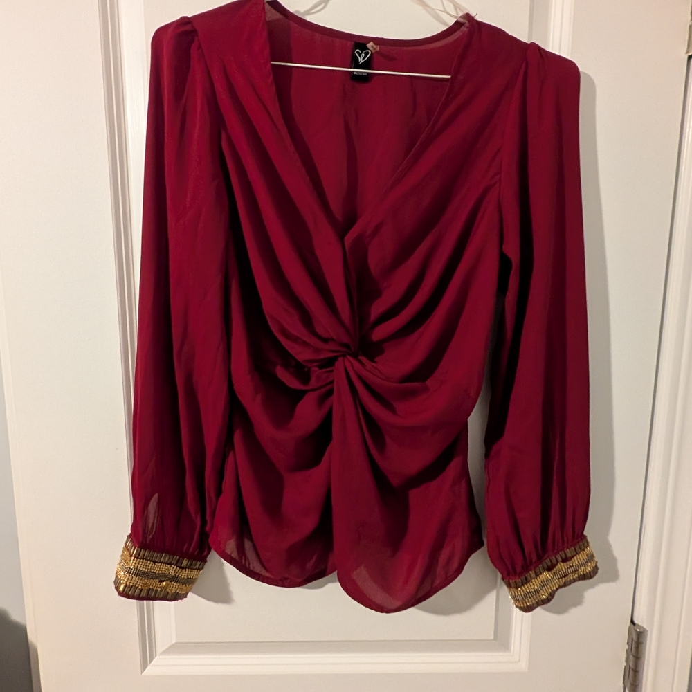 Burgundy Knotted Middle Top With Gold Beading On Sleeves.